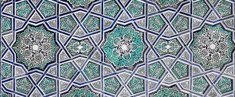 Geometric traditional Islamic ornament. Fragment of a ceramic mosaic. Abstract background. photo