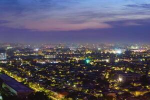 Uzbekistan, Tashkent - September 29, 2023 Top view from the observation deck on the Tashkent TV tower to the central part of the city covered with smog at nighttime . Air polution. photo