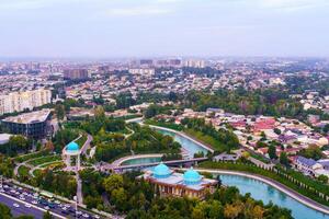 Uzbekistan, Tashkent - September 29, 2023 Top view from the observation deck on the Tashkent TV tower to the central part of the city covered with smog at sunset . Air polution. photo