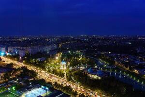 Uzbekistan, Tashkent - September 29, 2023 Top view from the observation deck on the Tashkent TV tower to the central part of the city covered with smog at nighttime . Air polution. photo