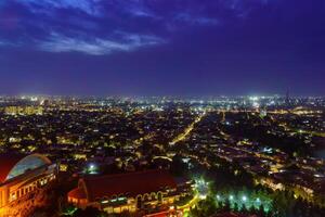 Uzbekistan, Tashkent - September 29, 2023 Top view from the observation deck on the Tashkent TV tower to the central part of the city covered with smog at nighttime . Air polution. photo