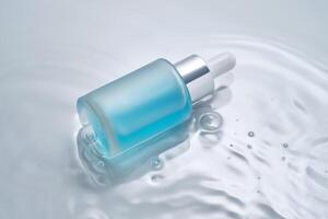 Bottles of cosmetics with a dropper in water on a blue background. photo