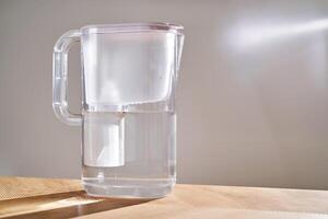 Jug with water filter in the interior. photo