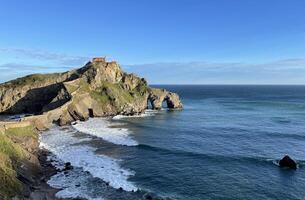 View over San Juan de Gaztelugatxe in Spain during sunrise photo