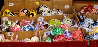 Beautiful colorful decor for Easter. Traditional Easter painted colorful eggs are sold at a market in Prague, Czech Republic. photo