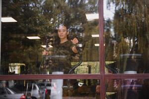 Woman was running on the treadmill in the gym. photo