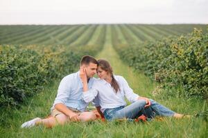 Loving guy and girl walking in nature.concept of love story outdoor.Lovers Walking in spring park.stylish couple in love hugging on a walk in spring. photo