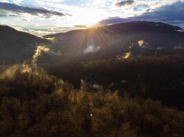 Autumn forest against the backdrop of canyons and mountains photo