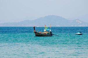 Views of the Islands of Thailand and turquoise water, rocks, yachts or boats photo