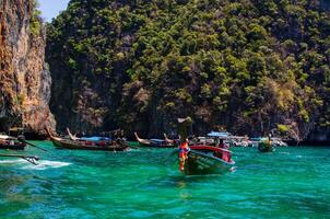 Views of the Islands of Thailand and turquoise water, rocks, yachts or boats photo