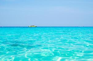 Tropical islands of ocean blue sea water and white sand beach at Similan Islands with famous Sail Rock, Phang Nga Thailand nature landscape photo