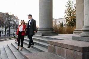 Business people walking and talking in the street photo