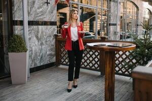 Portrait of business women in feeling of concentrate stress and see stand and hold the paper file sheet in the outdoor pedestrian walk way with the city space of exterior modern facade building. photo