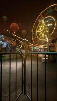 Ferris Wheel Illuminates Abandoned Amusement Park at Night video