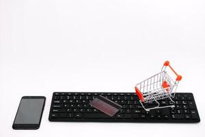 online shopping or internet shop concepts, with shopping cart symbol. isolated. photo