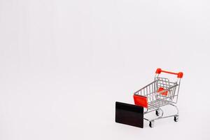 online shopping or internet shop concepts, with shopping cart symbol. isolated. photo