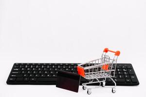 online shopping or internet shop concepts, with shopping cart symbol. isolated. photo