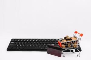 online shopping or internet shop concepts, with shopping cart symbol. isolated. photo