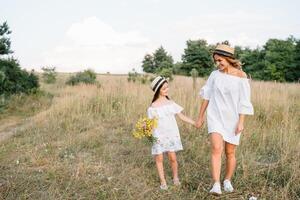 Young mother and her daughter have fun, mother's Day. photo