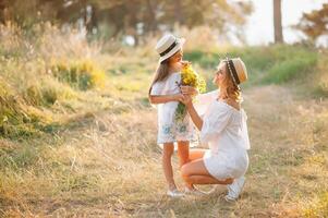 Young mother and her daughter have fun, mother's Day. photo