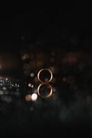 Beautiful wedding rings on light background. photo