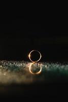 Beautiful wedding rings on light background. photo