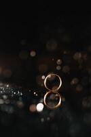 Beautiful wedding rings on light background photo