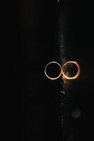 Beautiful wedding rings on light background. photo