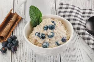 Oats porridge with blueberry photo