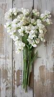 White Sweet Peas On Wooden Background photo