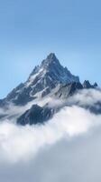 Majestic Mountain Peak Above Clouds photo