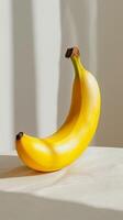 Single Banana on White Surface photo