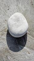 Smooth White Stone On Beach photo