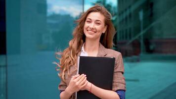 Successful businesswoman celebrating victory outside office building video