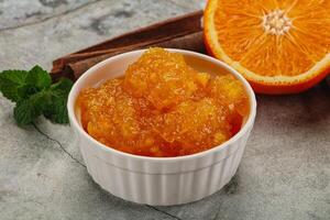 Tasty homemade Orange jam in the bowl photo