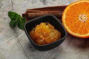 Tasty homemade Orange jam in the bowl photo