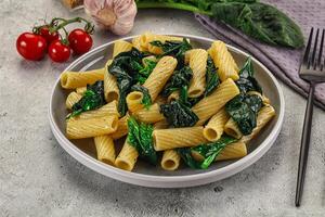 Italian cuisine - tortiglioni with spinach photo