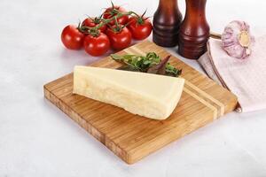 Piece Italian hard parmesan cheese photo