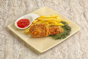 Crispy chicken leg with fry potato photo