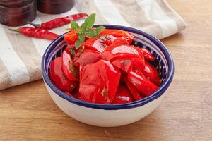 Marinated red bell pepper with oil photo