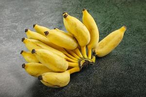 Small sweet ripe banana heap photo