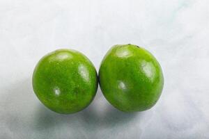 Two ripe green exotic avocado fruit photo