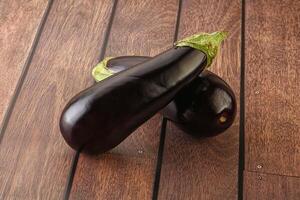 Two Fresh ripe black eggplants photo