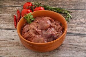 Raw chicken liver in the bowl photo