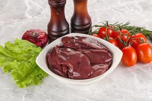 Raw turkey liver in a bowl ready for cooking photo