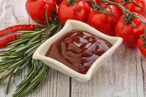 Tomato barbecue sauce on the bowl photo