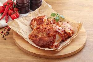 Marinated chicken leg in tomato sauce photo