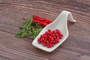 Red pepper seeds in the bowl photo