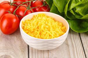 Shredded cheese in the bowl photo