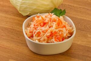 Sauerkraut - pickled cabbage in the bowl photo